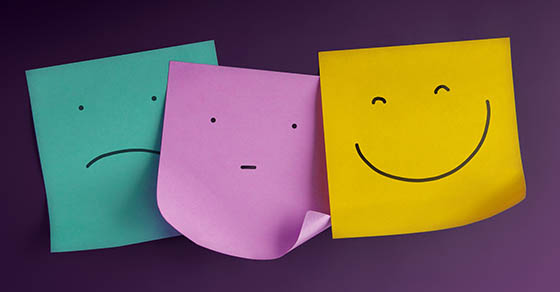 happy, sad and straight face on post it notes