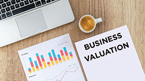 image of papers with chart and text: business valuation