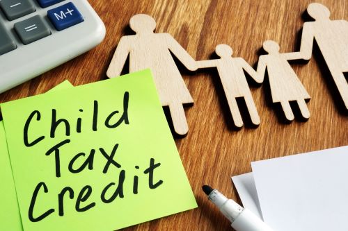 image of children cutouts with text child tax credit