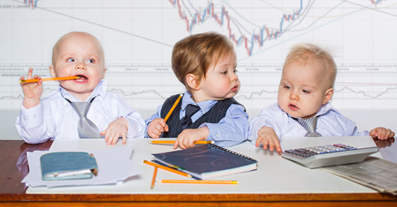 babies with notebooks and calcuators