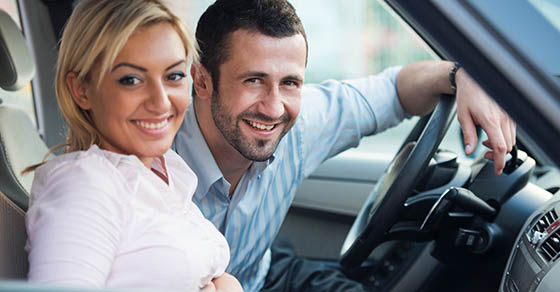 husband and wife in car