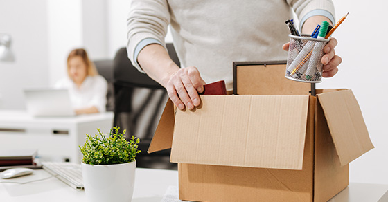 man packing up box