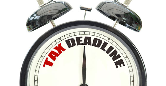 alarm clock with the words tax deadline