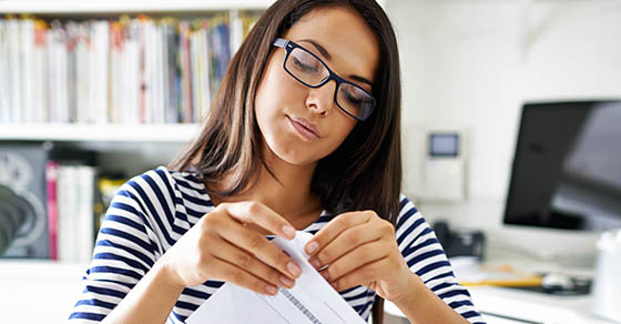 women opening an envelope