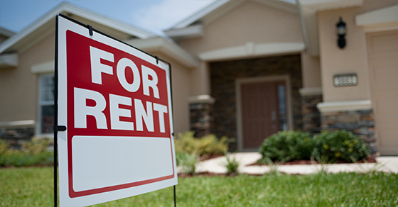 rent sign in front of house