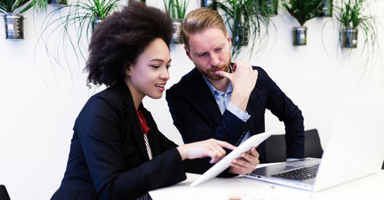 man and women reviewing paperwork