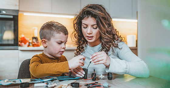 photo of mom and son working on project