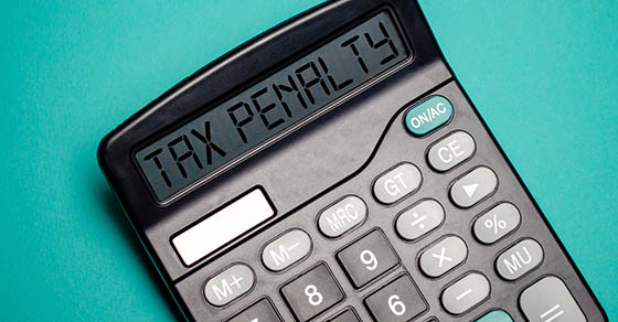 calculator with the word tax penalty