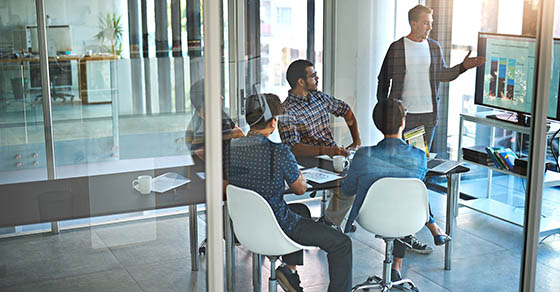 business men looking at computer monitor