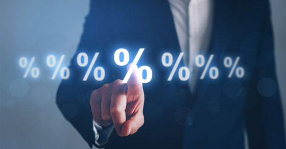 man pointing a percent sign on screen