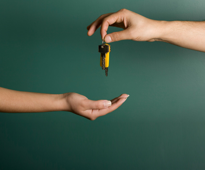 image of passing keys from one hand to another