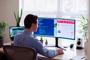 image of man sitting at computer