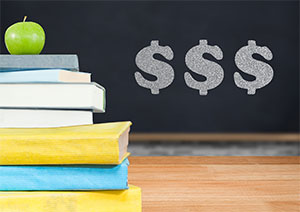 image of school textbooks and chalkboard with dollar signs