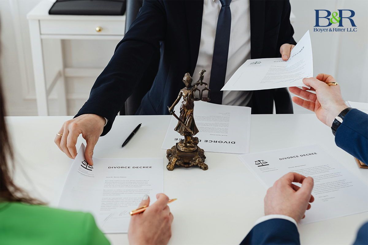 man and woman at desk with papers