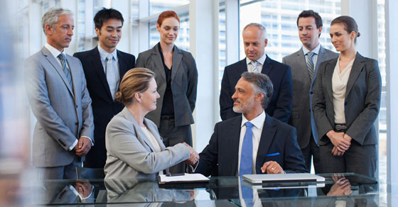 group of professionals shaking hands