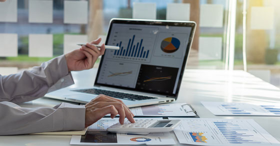 image of man's arm pointing at computer