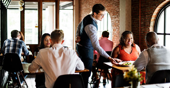 couple being served at restaurant