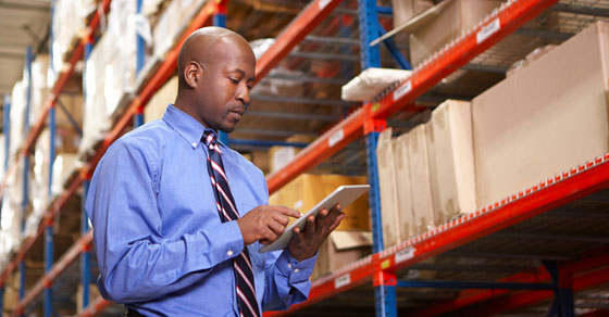 man holding clipboard in warehouse