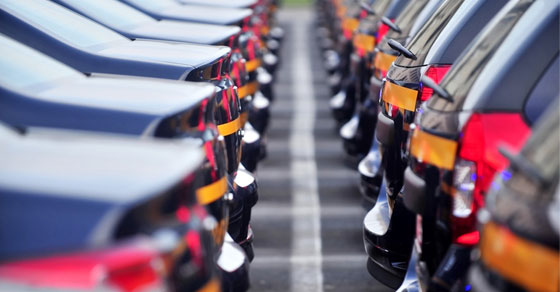 image of rows of cars in parking lot