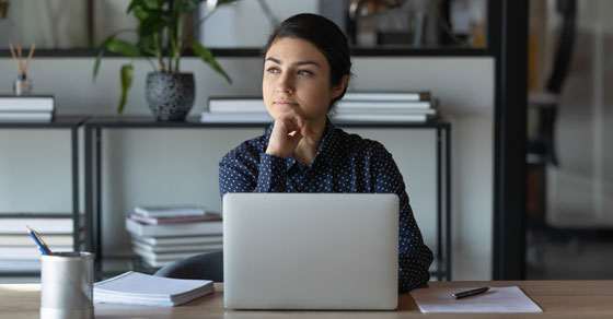 image of woman on laptop thinking