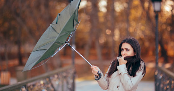 image of woman with umbrella blowing